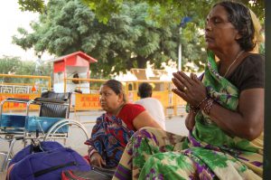Roshanadevi, performing her daily chores on the pavement ,praying to god to end her ordeal