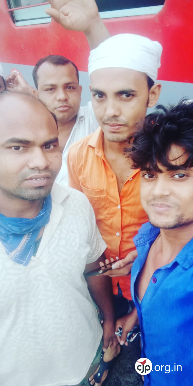 Munna Sheikh (waving) after reaching Katihar with his friends